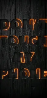 Bold 'Don't Touch My Phone' wallpaper with dark background and orange accents.