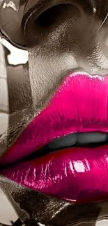 Artistic close-up of bold pink lips on a glossy surface.