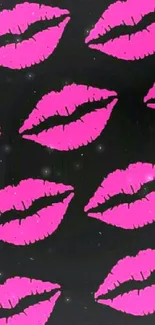 Vibrant pink lips on black wallpaper.