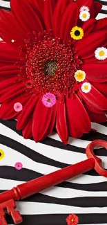 Red flower and key on zebra stripes wallpaper.