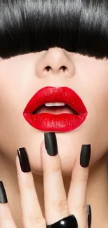 Mobile wallpaper with bold red lips and black nails for a chic look.