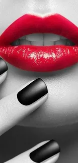 Wallpaper with bold red lips and black nails on a monochrome face.