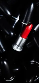 Red lipstick surrounded by black casings in a chic design.