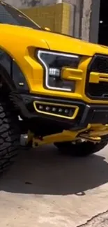 Bold yellow truck with rugged tires.