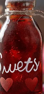 Decorative bottle with heart design on a mobile wallpaper.