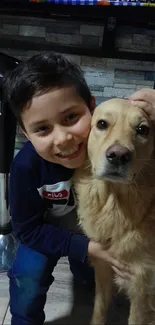 Boy hugging a golden retriever with a big smile on his face.