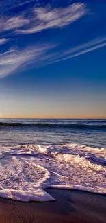 Beautiful beach sunset with waves crashing gently on golden sand.