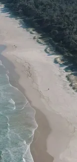 Aerial view of a serene and picturesque beach with gentle waves and sandy shores.