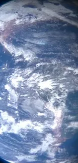 Stunning view of Earth from space, showcasing vivid blues and white clouds.