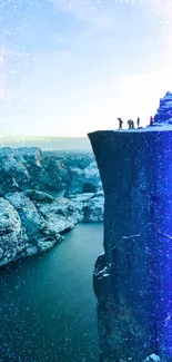 Adventurers atop a cold cliff with a breathtaking winter fjord view.