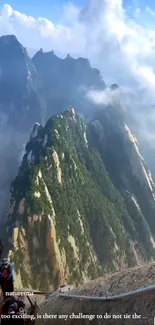 Breathtaking view of climbers on a steep mountain surrounded by clouds.