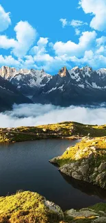 Serene mountain landscape with lake and blue sky.