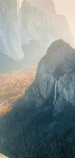 Adventurer on cliff with majestic mountain landscape at sunrise.