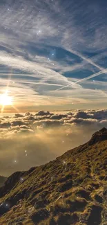 Sun setting over mountains with golden clouds and vibrant sky.