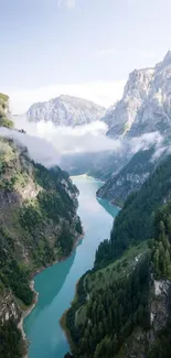 Breathtaking view of a mountain valley with a winding river and lush greenery.