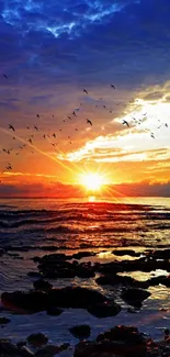 Vibrant ocean sunset with colorful sky and birds flying above serene waves.