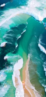 Vibrant aerial view of ocean waves on a sandy beach creating stunning teal patterns.