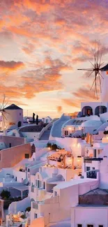 Stunning view of Santorini's iconic sunset with windmills and white buildings.