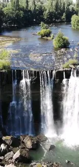 Lush green forest with cascading waterfall in landscape view.