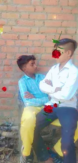 Two children sitting against a brick wall with scattered roses.