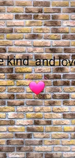 Inspirational brick wall wallpaper with 'Be Kind And Love' text and heart symbol.