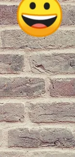 Smiley face on a rustic brick wall background wallpaper.