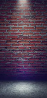 Red brick wall under a spotlight, creating a dramatic effect.