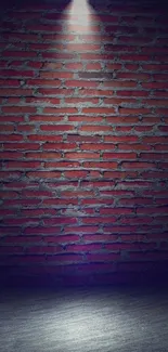 Brick wall with spotlight in dark setting.