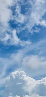 Peaceful blue sky with fluffy clouds wallpaper.