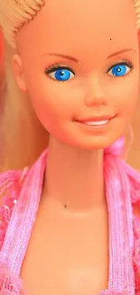 Bright pink doll with blue eyes wearing a pink outfit.