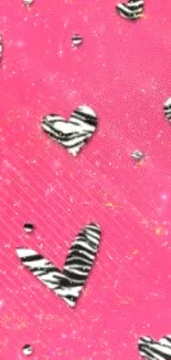 Bright pink wallpaper with zebra-patterned hearts.