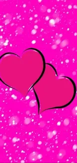 Bright pink hearts with sparkling accents on a vivid background.