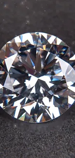 Close-up of a brilliant diamond on a dark surface for mobile wallpaper.