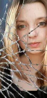 Artistic portrait with cracked glass effect on mobile wallpaper.