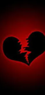 Broken heart with red glow on a dark background wallpaper.