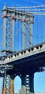 Urban bridge against a clear blue sky, showcasing detailed architecture.