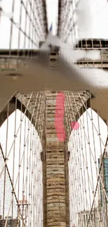 Brooklyn Bridge with cables in urban setting.