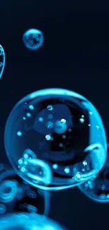 Blue bubbles floating on dark background wallpaper.