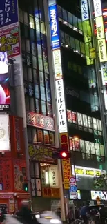 Vibrant Tokyo cityscape at night with neon signs.