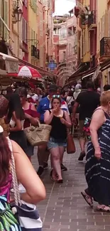 Vibrant European street filled with shoppers and colorful buildings.