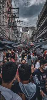 Crowded urban street with bustling activity and diverse crowd.