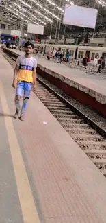 Train station view with people and tracks.