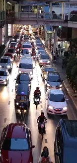 Urban street with bustling traffic and vibrant city lights at night.