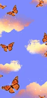 Wallpaper with orange butterflies in a dreamy, light blue sky with clouds.