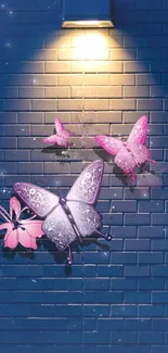 Pink butterflies on blue brick wall illuminated by warm light.