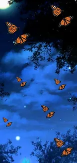 Orange butterflies fluttering in a moonlit night sky surrounded by trees.