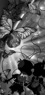 Black and white wallpaper with butterflies and couple silhouette.