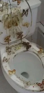 Butterfly themed toilet seat design in bathroom.