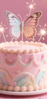 Pink cake with butterfly topper and sparklers.