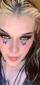 Portrait with blue butterfly stickers on face, exuding elegance and whimsy.